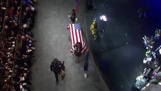Deputy Pickett's K-9 partner stops in front of his casket