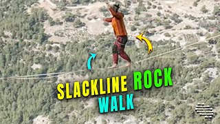 Guy Walks on a Slackline Stretched between Two Rocks