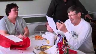 Dave Cosgrove opening his retirement party gag gifts