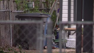 Questions linger after body found in trash bag at west-side home leads to son's arrest