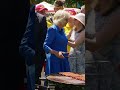 King and Queen take up the tongs at sausage sizzle in Sydney park