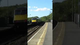 DB Cargo 67015 hauls TfW MK4 set through Llanharan