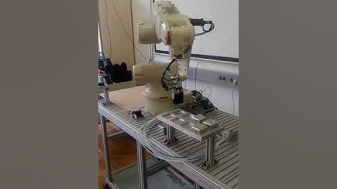 Motoman NX100 manipulation