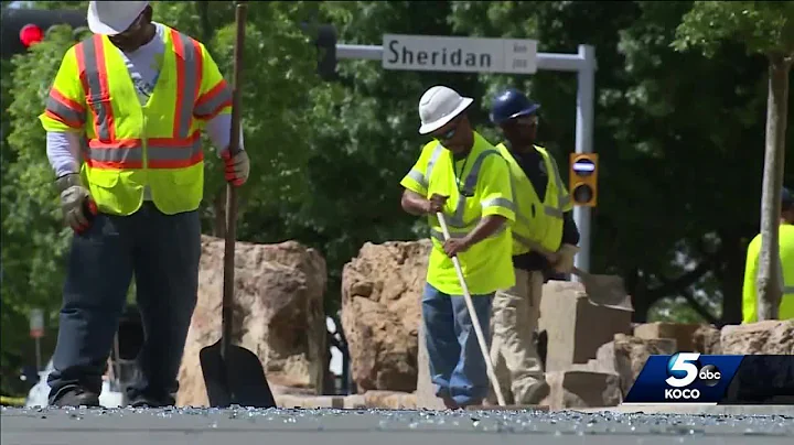 Crews cleaning up fallen, shattered glass after in...
