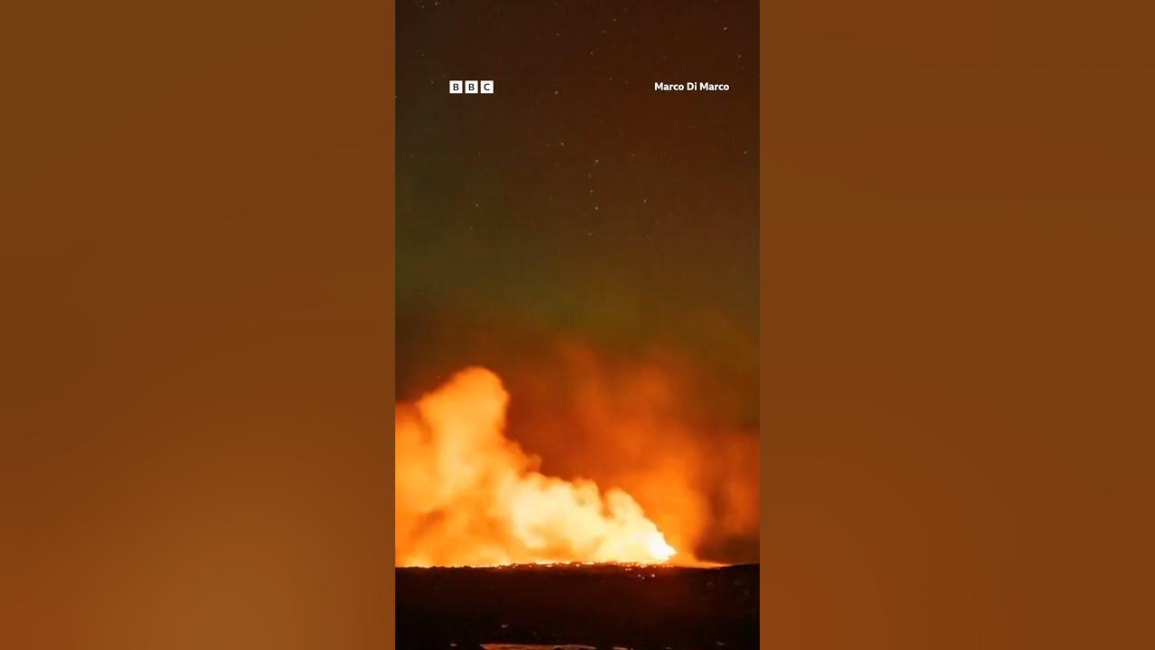 Northern Lights captured glowing over erupting Iceland volcano. #Shorts #Grindavik #BBCNews