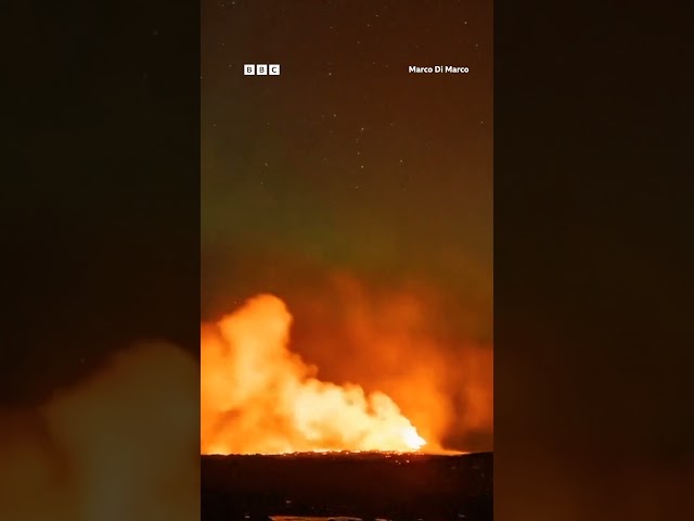 Northern Lights captured glowing over erupting Iceland volcano. #Shorts #Grindavik #BBCNews