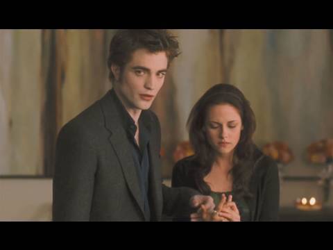 Twitter.com - Follow Us! New clip of the Bella birthday scene where she gets a paper cut. Check it out! "The Paper Cut" Clip is courtesy of Summit Entertainment. The Twilight Saga: New Moon will be in theaters November 20, 2009. Plot Synopsis: In THE TWILIGHT SAGA: NEW MOON, Bella Swan (Kristen Stewart) is devastated by the abrupt departure of her vampire love, Edward Cullen (Robert Pattinson) but her spirit is rekindled by her growing friendship with the irresistible Jacob Black (Taylor Lautner). Suddenly she finds herself drawn into the world of the werewolves, ancestral enemies of the vampires, and finds her loyalties tested.