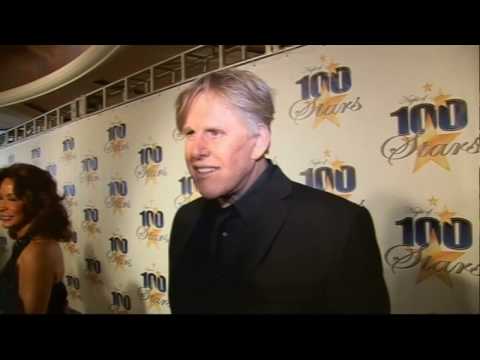 Gary Busey gets weird on Oscars red carpet