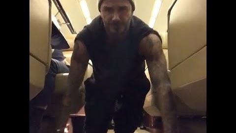 David Beckham completes 22 push-up challenge on an airplane