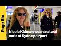 Nicole Kidman pairs natural curls with a tailored Chanel look at the Sydney airport