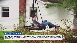 Eight-year-old saved from flood waters