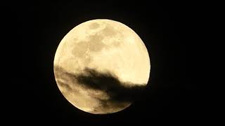 Super Full Moon 2020 with Clouds Moving Across It. Night Sky Astro Photography from Arizona.