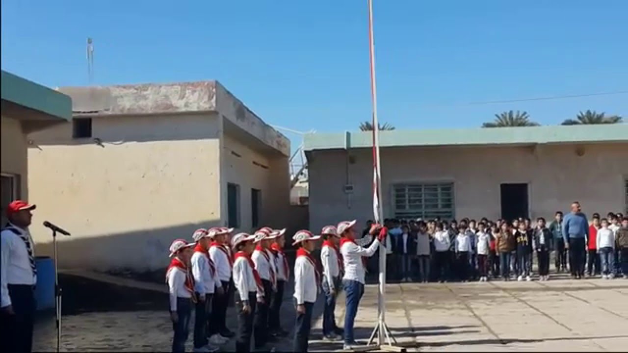 يوم الخميس ومراسم رفع العلم  العراقي .....من مدرسة دجلة