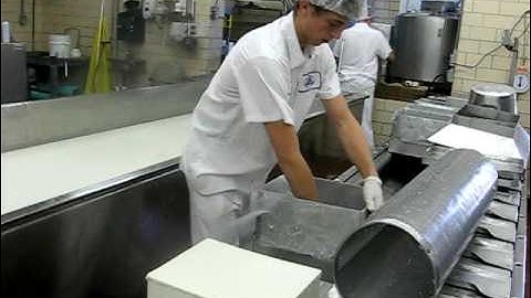 Packaging 40-pound blocks of cheese