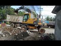 Volvo EW145B Wheel Excavator Loading Digging Soil Howo Sinotruk Dump Truck