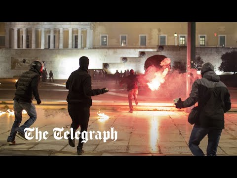 Greece train crash: police fire tear gas to disperse protesters in athens