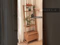 Log style trapezoidal flower stand against the wall without taking up space with flowers a