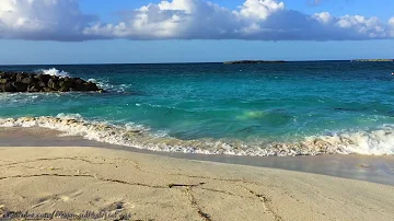 secluded island beach | crashing waves | bluest clear ocean water