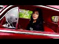 Genesis Duran shows off her 1950 Chevy Coupe lowrider