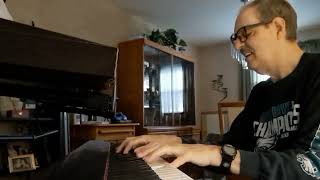 "The Long and Winding Road" by Paul McCartney on piano w/voice.