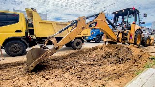 CAT Backhoe Loader Crushing Road in Public & Working with Dump Truck for Road Recovery  Roadwork