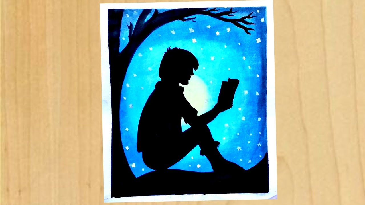 Boy Reading A Book Under The Tree