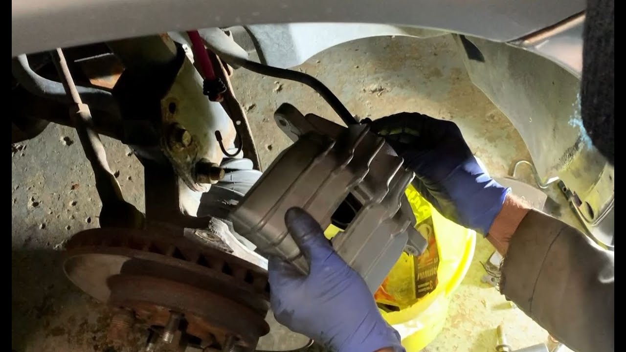 2003 Chevy Malibu front brake caliper replacement - YouTube