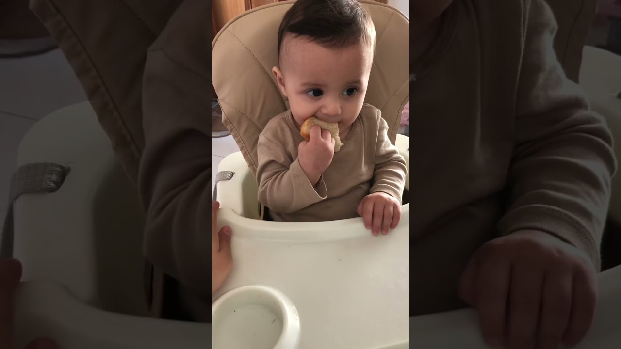 Baby eating bread 🍞