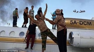 Pictured Libyan Islamist Rebels Pose With Planes Seized From Tripoli Airport As U.s. Officials..