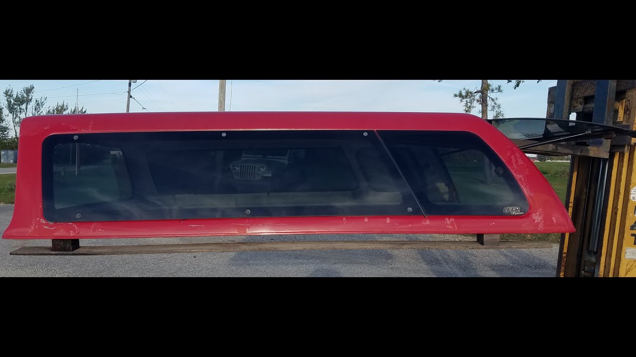 Walk around used fiberglass truck topper for sale. Leer Signature cab