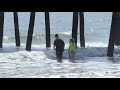 Tourists continue enjoying beaches despite coronavirus threat