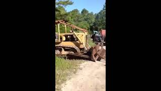 CATERPILLAR. D6 Crawler Dozer with Root Rake for Sale at Online Auction.