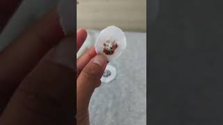 A tiny hand embroidered bunny with roses that turns into a necklace|miniature embroidery