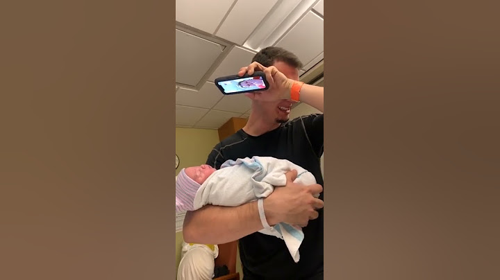 Dad Holding His Newborn Baby Starts Crying