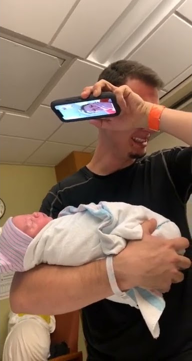Dad Holding His Newborn Baby Starts Crying