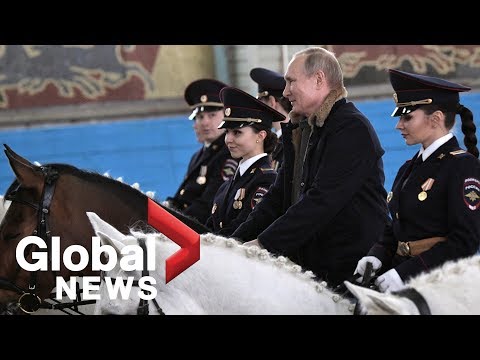 Vladimir Putin rides horse with female police officers ahead of International Women's Day