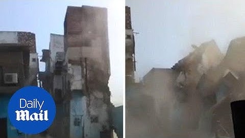 Terrifying moment entire three-storey building collapses in seconds - Daily Mail