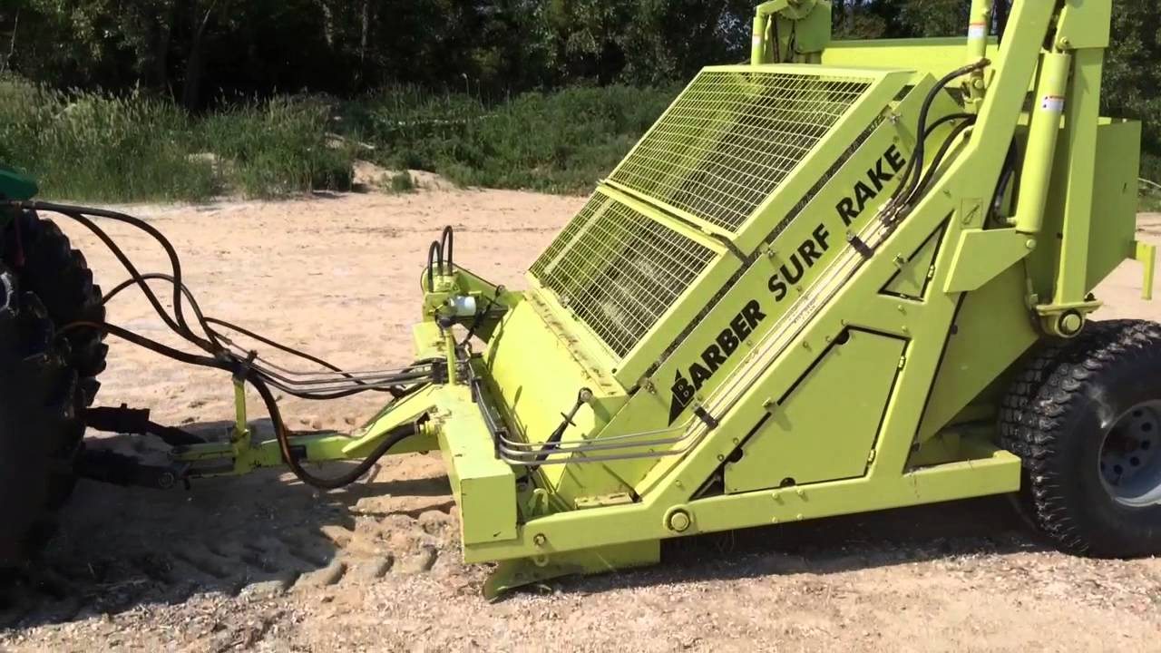 Ernie Krygier shows off a tractor-drawn beach groomer - YouTube