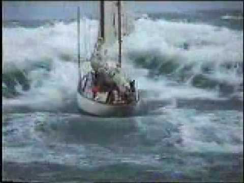 Stormy weather - sailboat in distress at sea