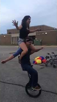 Tony Mills Riding a unicycle with Gabriel on his shoulders!!!