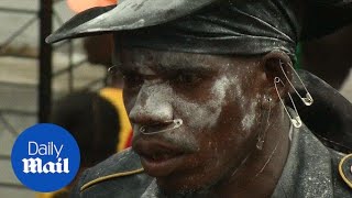 Haitians celebrate Day of the Dead with cemetary voodoo flair - Daily Mail