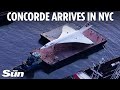Watch incredible moment BA&#39;s iconic Concorde floats down Hudson river in NYC after being restored