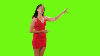 Young woman giving a presentation on a green screen