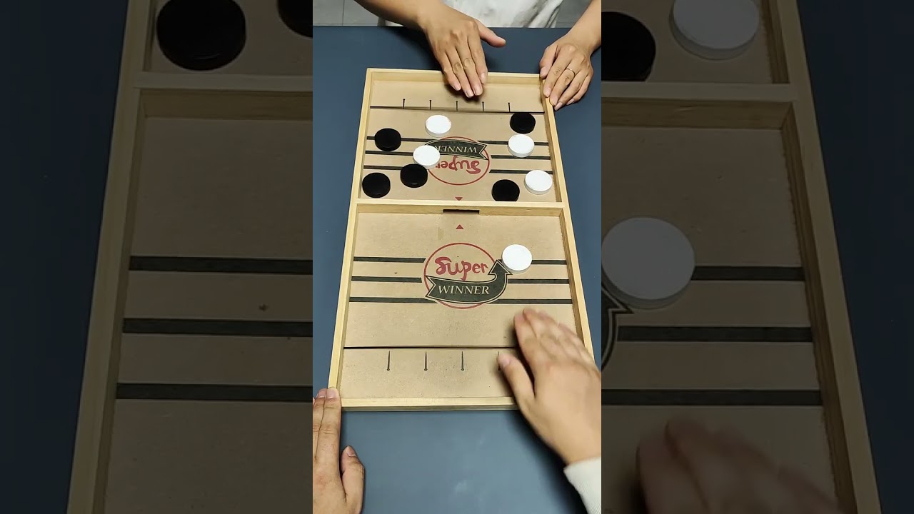 Very interesting two player sling puck game board 