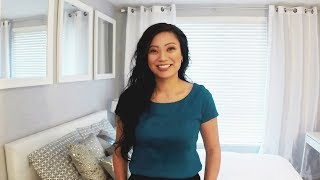 Tara shows how to make a small bedroom look bigger by using multiple mirrors to reflect the light in the room. She also uses a 