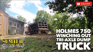 Holmes 750 winching out triaxle Dump Truck