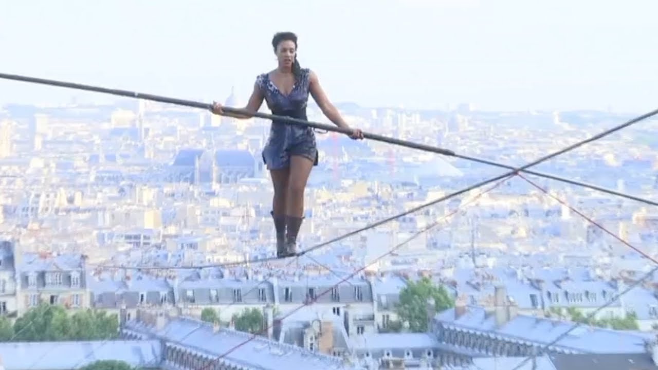 Hanging by a thread: Tightrope walker achieves 35m high stunt in