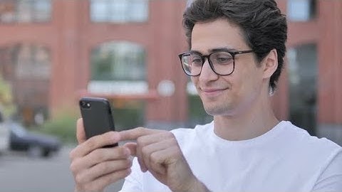 Young Man Using Smartphone | Stock Footage - Videohive