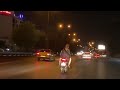 Woman riding on the back of a motorcycle in Tehran