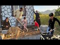 Ali with his family and the master builder in building a pond and beautifying the front of the house